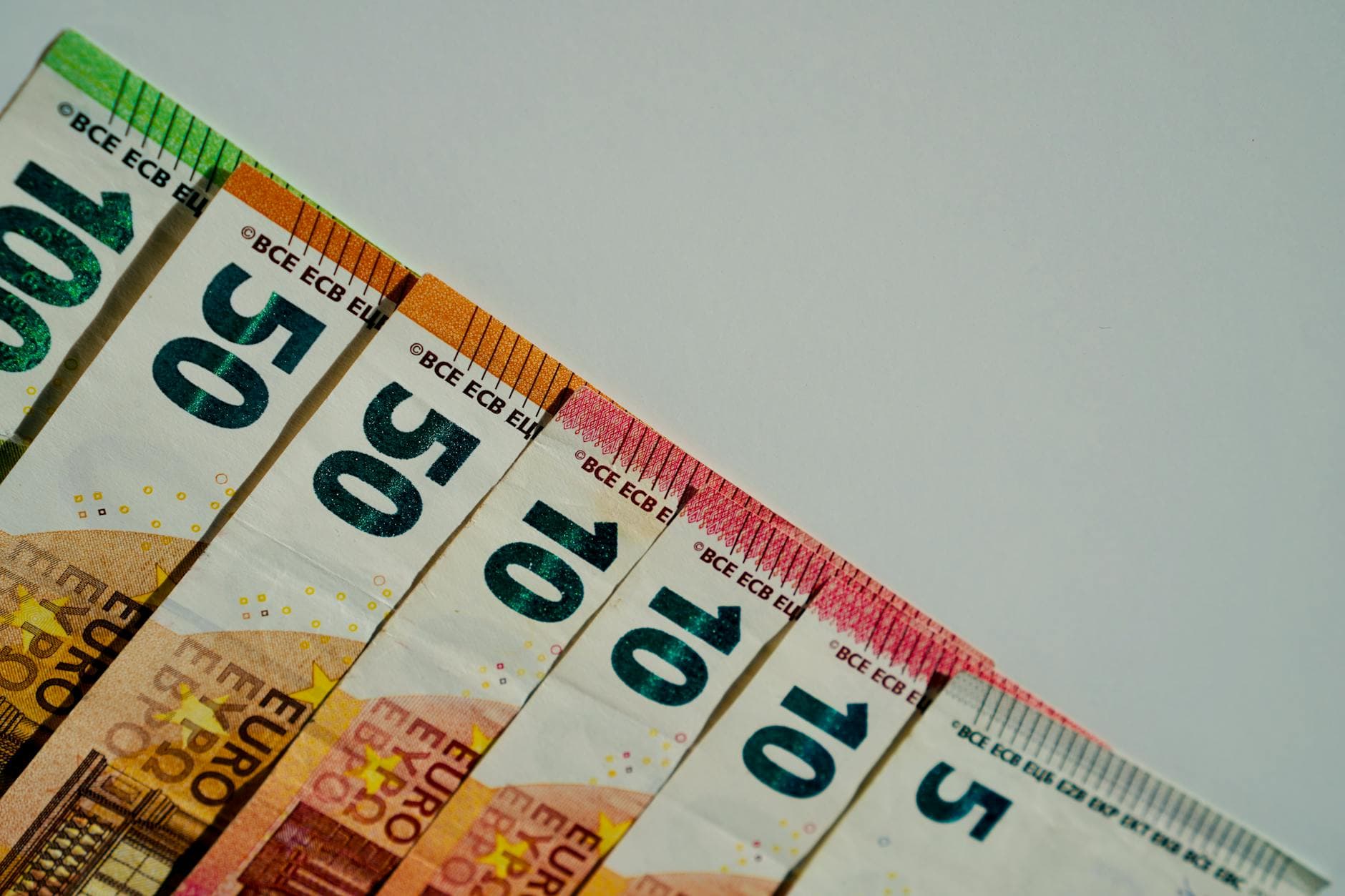 Close-up of a pregnant woman's belly with ultrasound gel being applied for a sonography session.