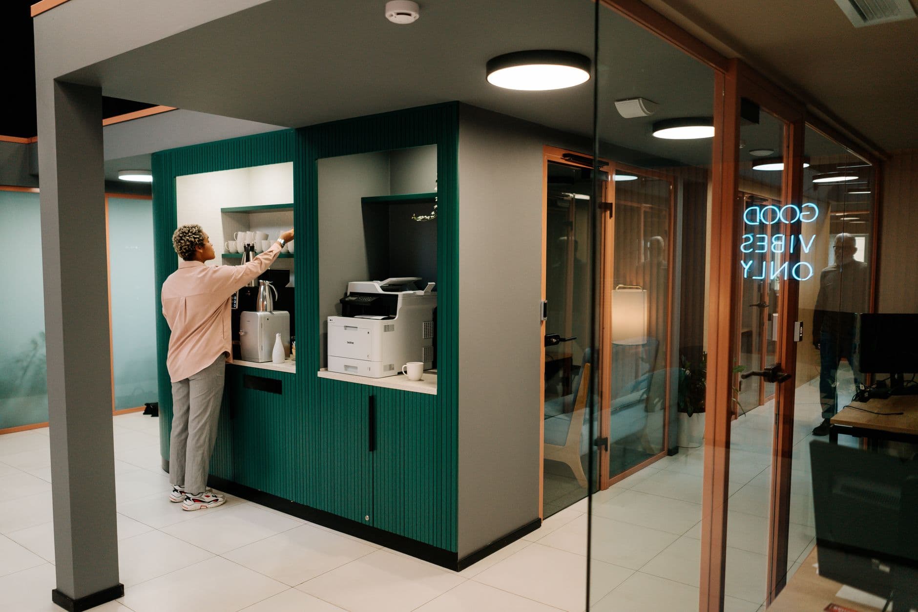 Office break area featuring a coffee station and modern interior design.