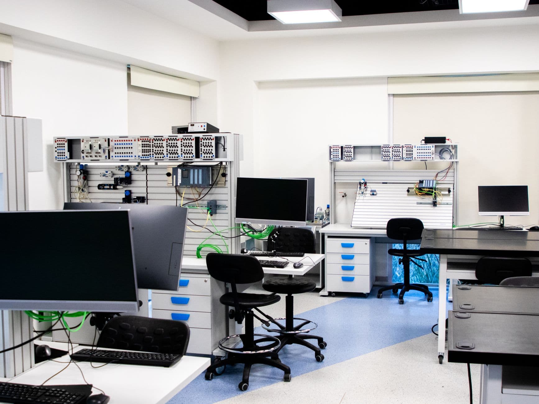 Bright modern laboratory with computers and technical equipment for research and analysis.