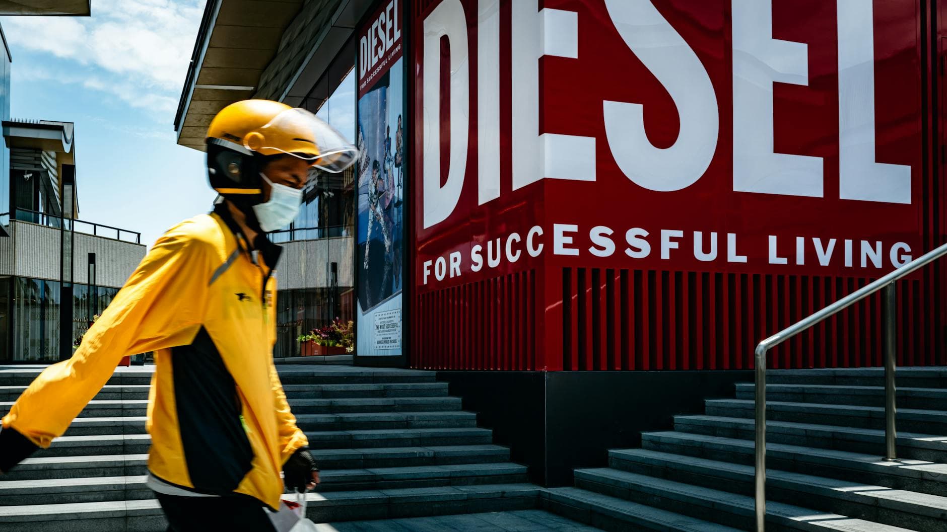 Glowing bright white ATM signboard hanging on wall in darkness in night time